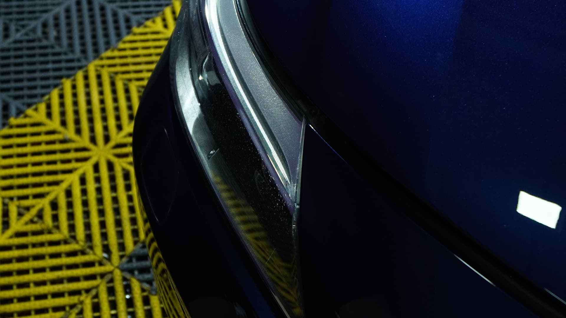 Gloss finish on a BMW Z4 front bumper over the BVT bay floor