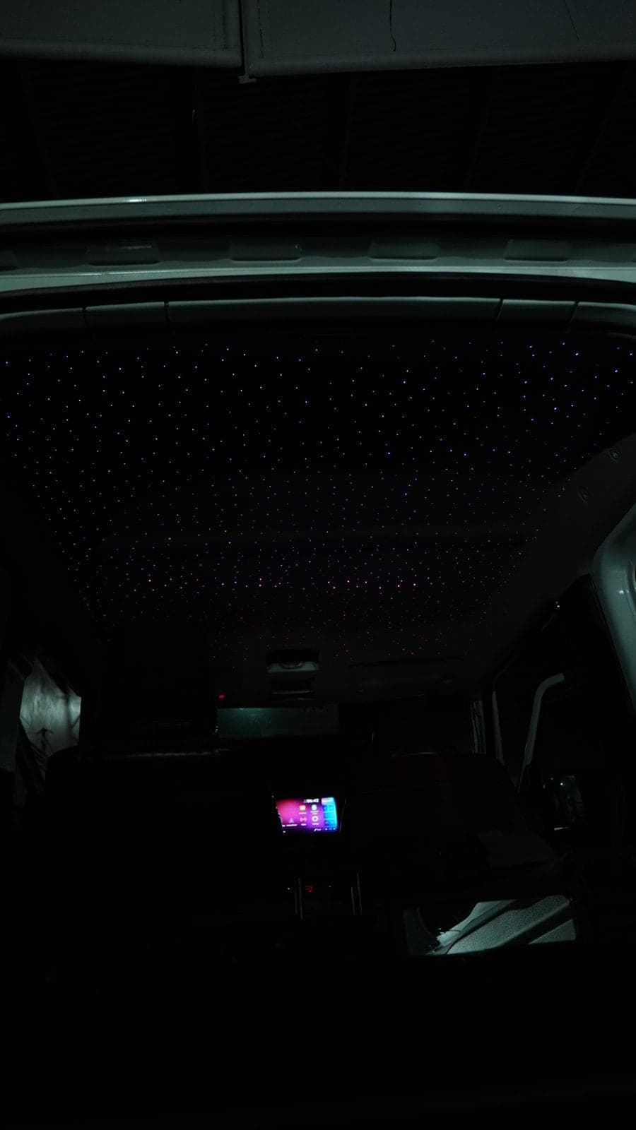 Starlight headliner glowing in the dark cabin of a Suzuki Jimny