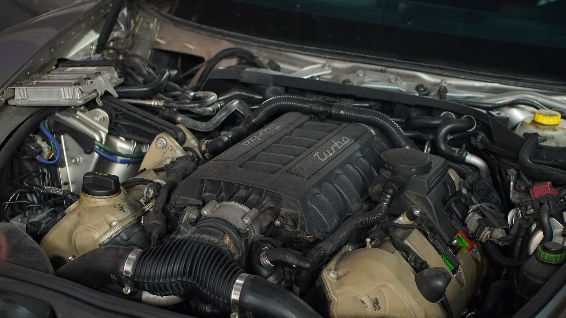 Porsche Panamera Turbo engine bay open for ECU work at BVT Tuning