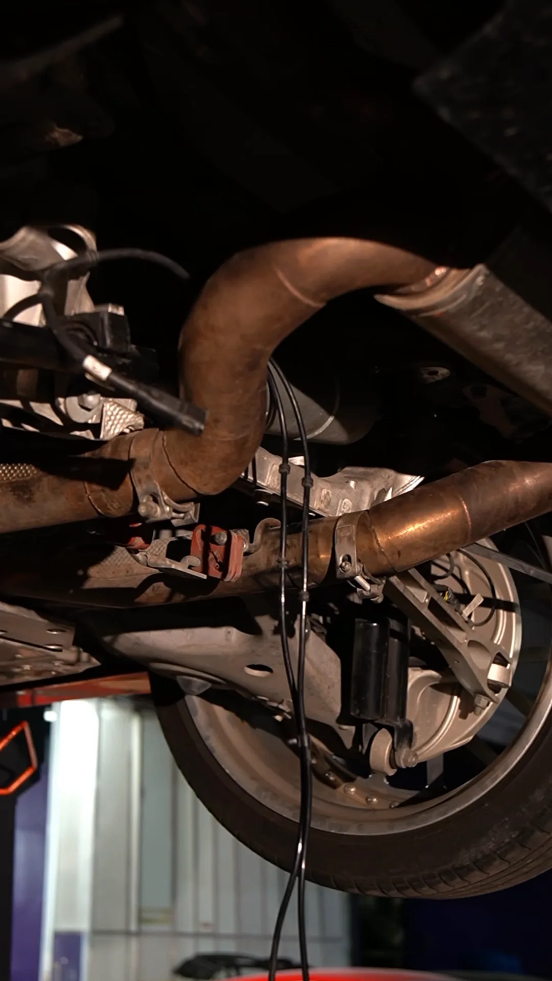 Aston Martin DBX: rear electric damper replacement, a still from BVT Tuning's film of the job