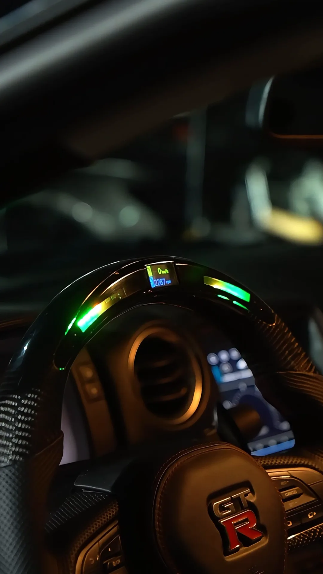 Nissan GT-R R35: Carbon steering wheel and reverse camera, a still from BVT Tuning's film of the job