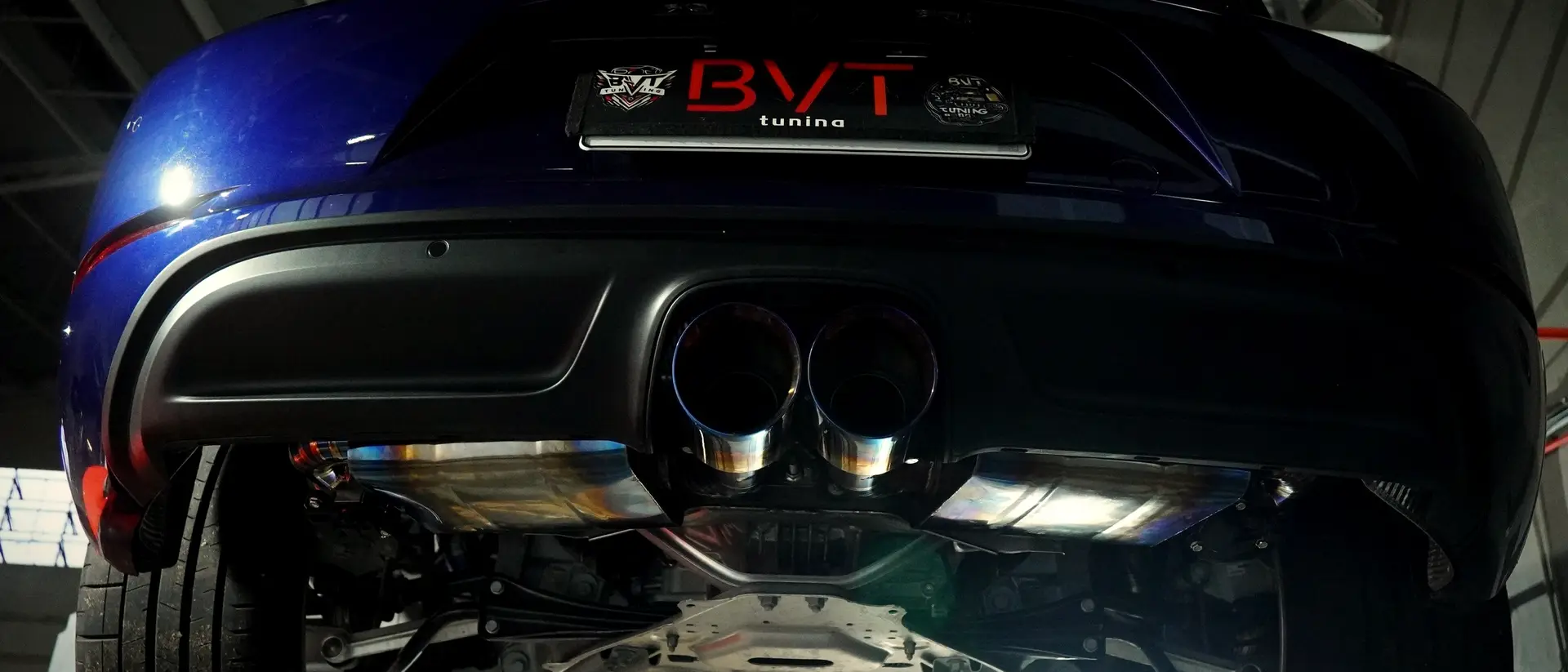 Titanium exhaust tips on a Porsche 718 Cayman S in the BVT bay
