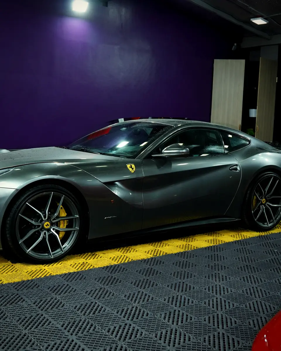 Ferrari F12 Berlinetta in the clean BVT Tuning workshop bay